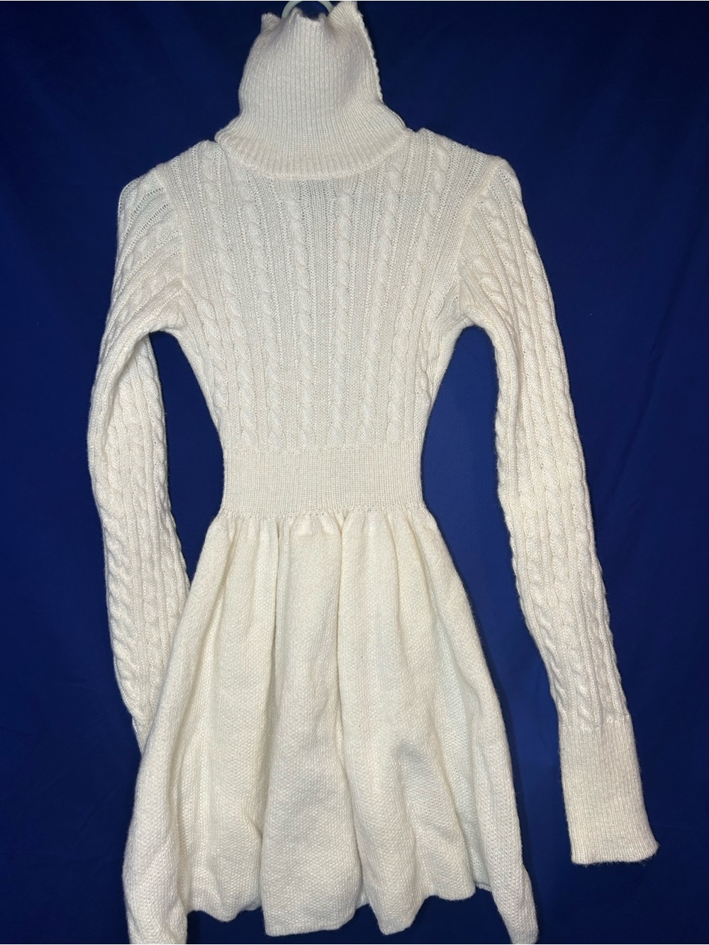 Neckline: A thick, ribbed turtleneck provides cozy warmth for colder weather